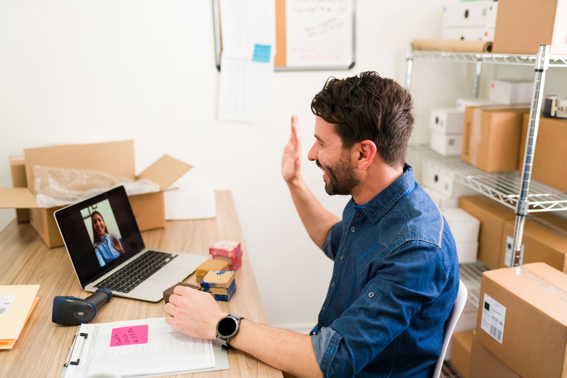 Latin man talking with a vendor on a video call